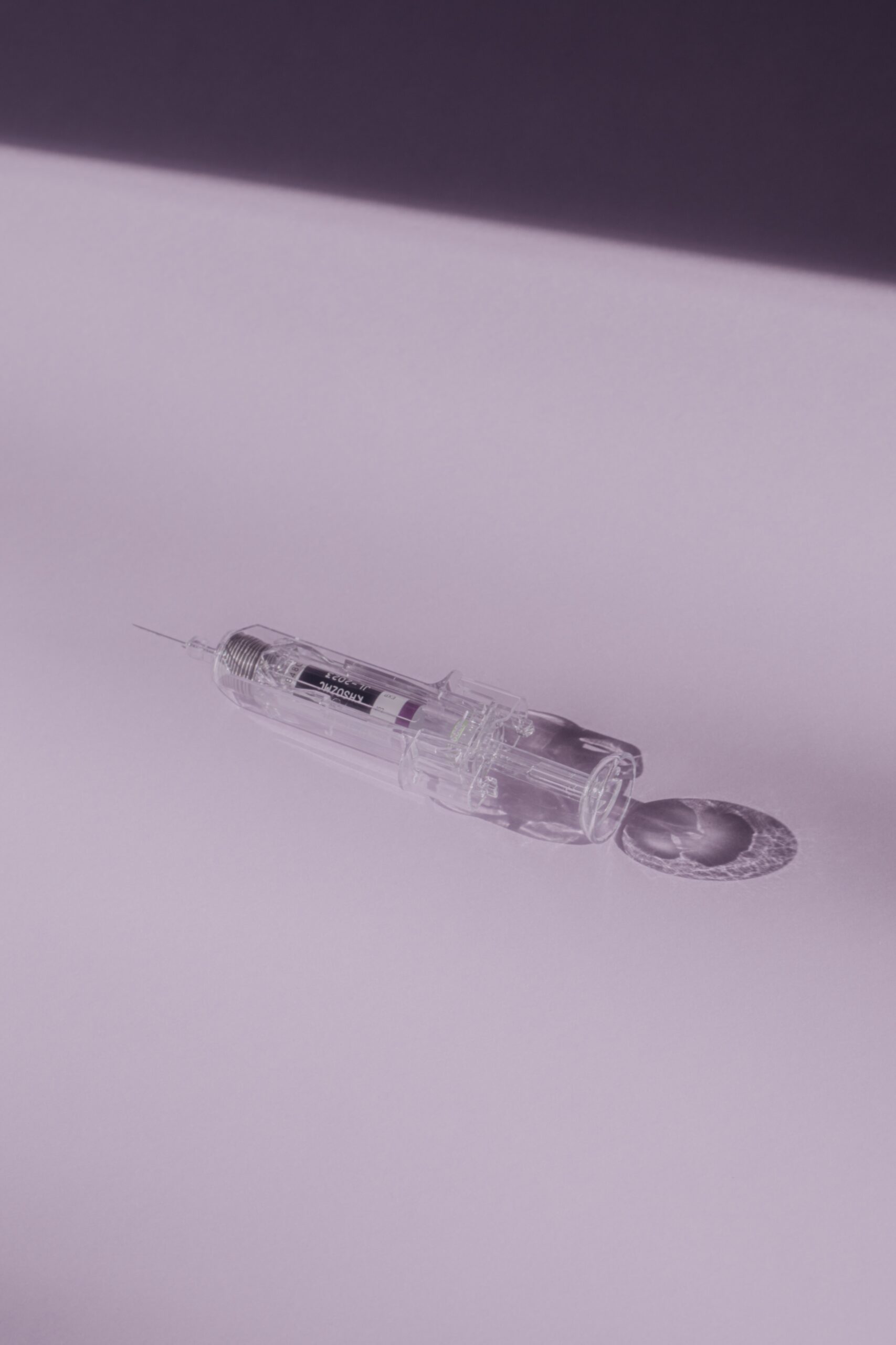 clear glass bottle on white surface