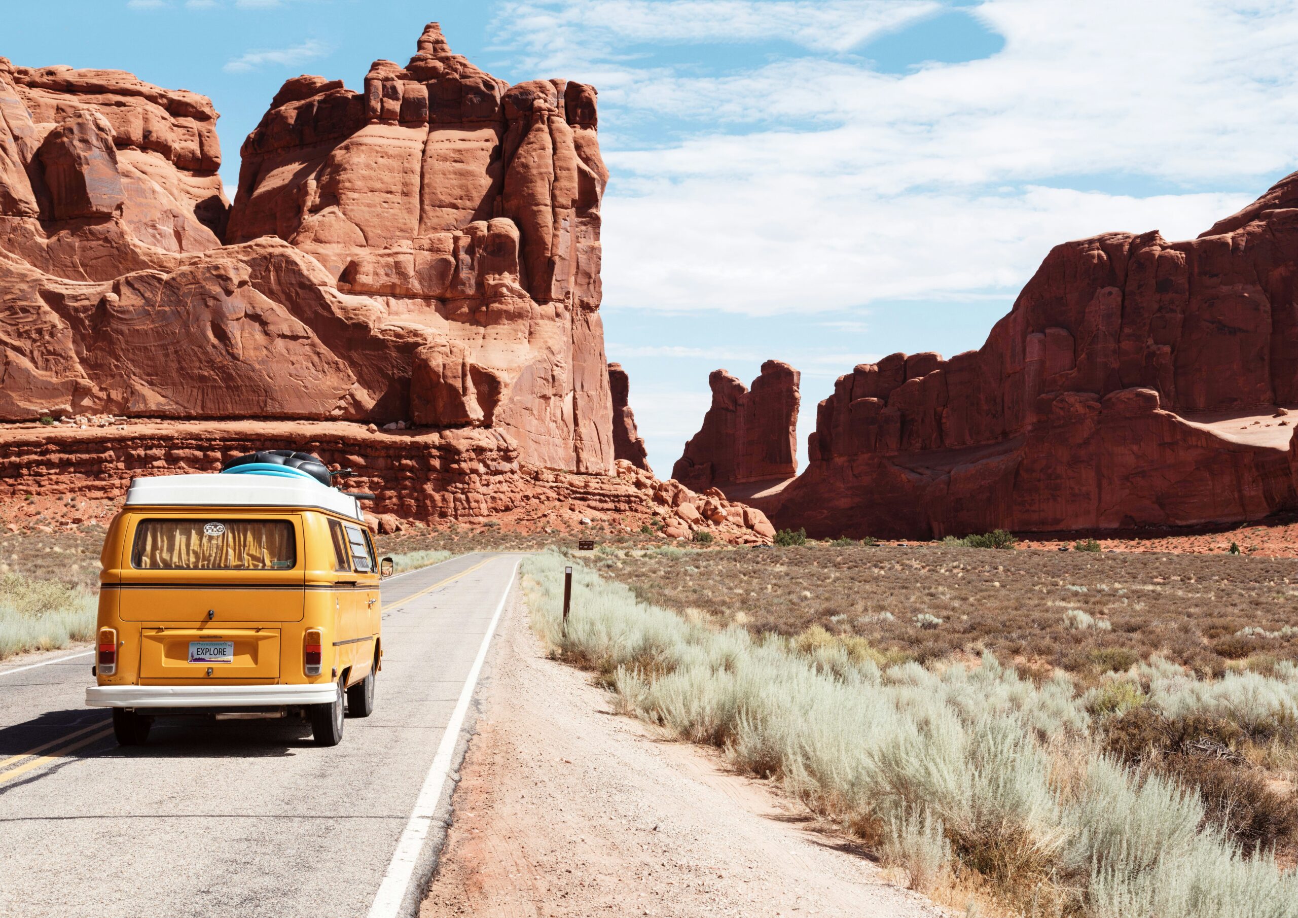 yellow Volkswagen van on road